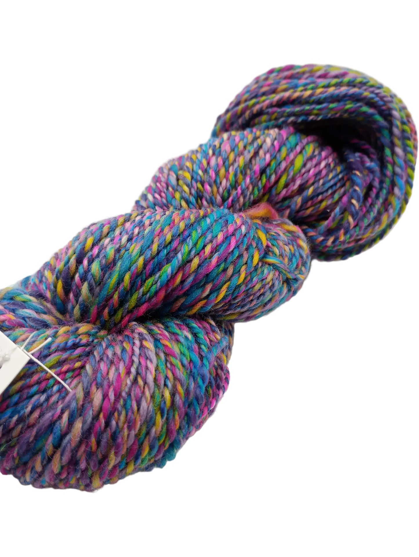 A skein of variegated yarn with twisted strands in purple, blue, pink, green, and yellow, photographed on a plain light background.