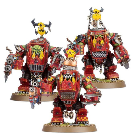 Three large, detailed robot figures on a white background